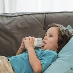 Omron MicroAIR NE-U100 Mesh Nebulizer -Home Furnishings Store omron young boy on sofa1